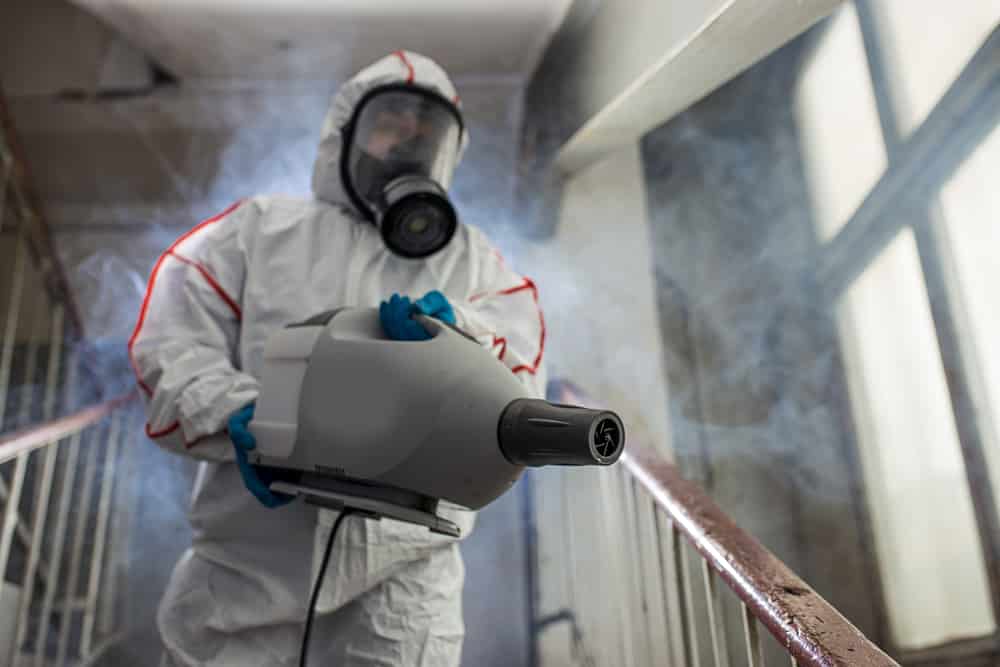 Disinfecting spraying stairs, desks, chairs, offices, tables, lunch room, break rooms
